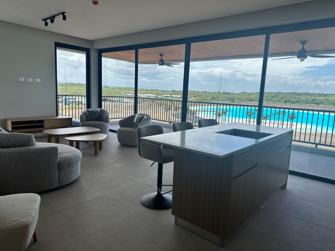 Living room opening onto a terrace above the lagoon